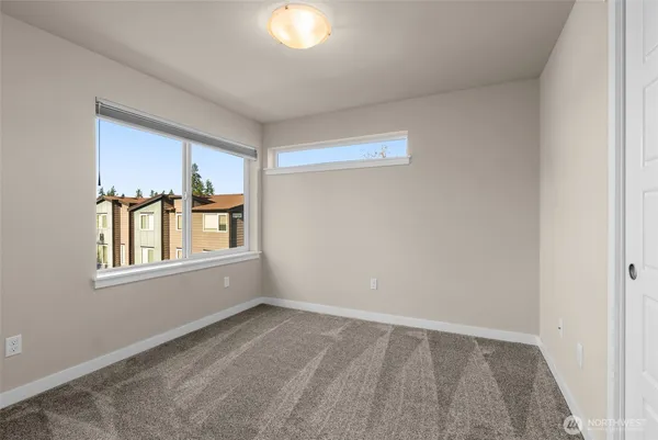 a bathroom with a sink a toilet a mirror and shower