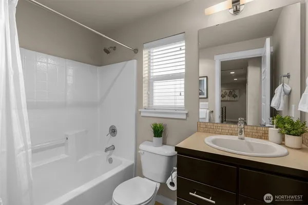 a stove top oven sitting next to a window