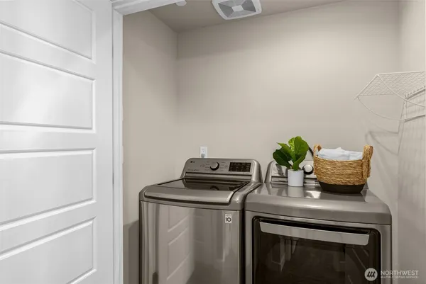 a bathroom with a sink mirror and toilet