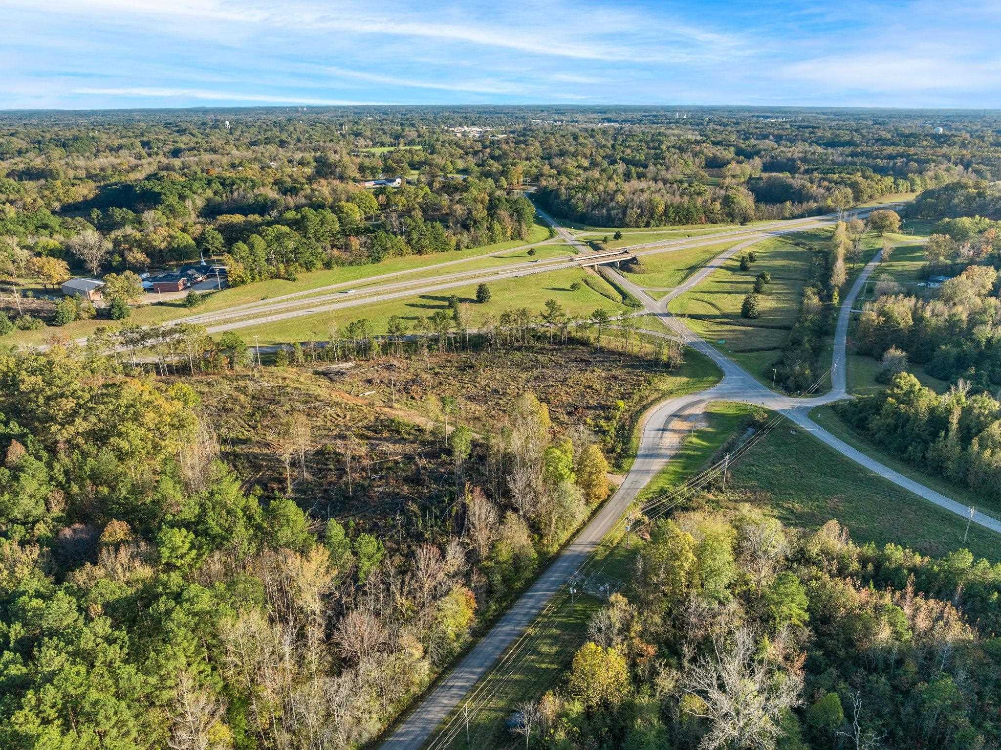 45 S Road Corinth, MS 38834 - Photo 16 of 34 Aerial overview of property's location featuring rural landscape and a heavily wooded area
