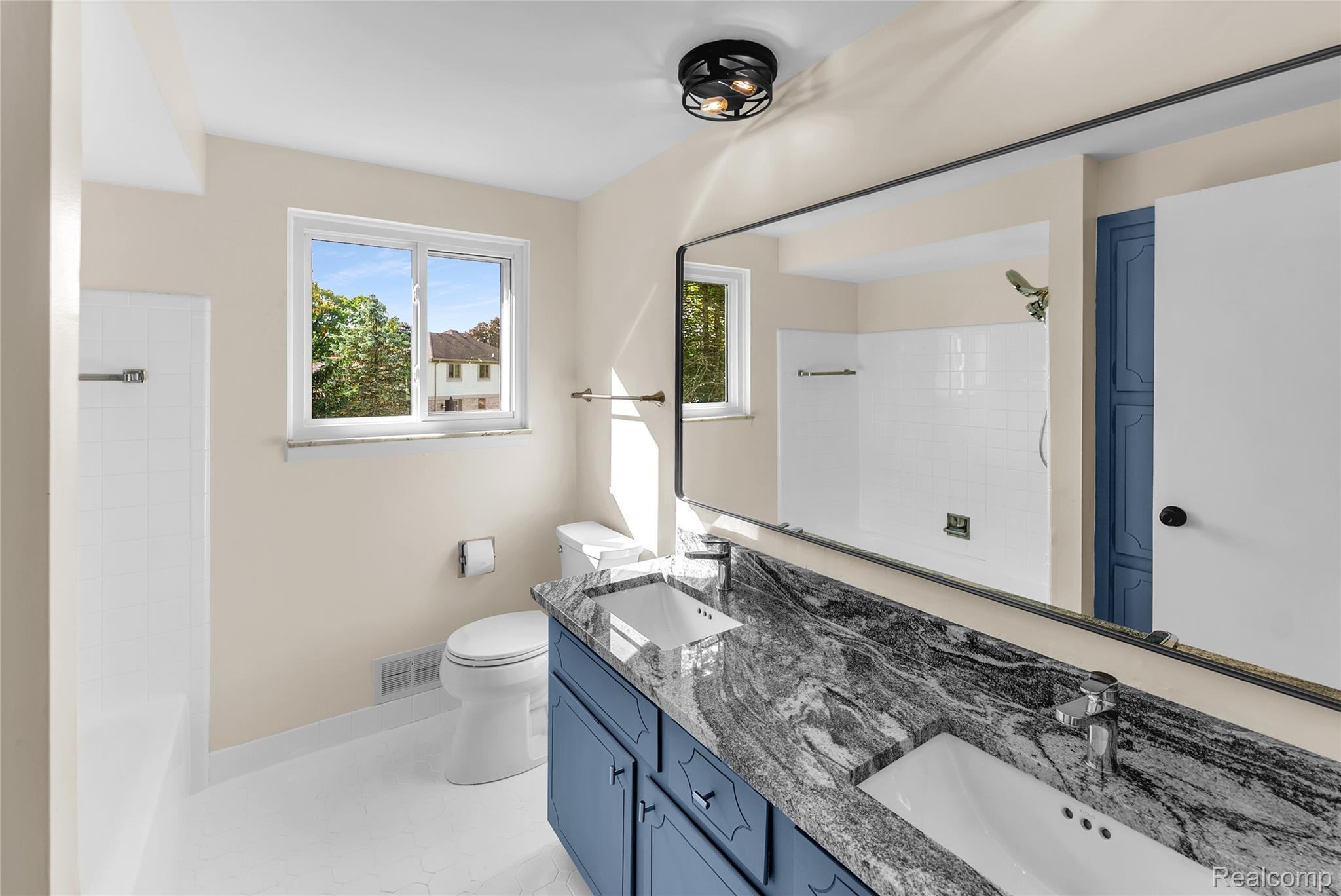 54011 Mound Road Utica, MI 48316 - Photo 23 of 27 Full bathroom featuring double vanity and shower / washtub combination