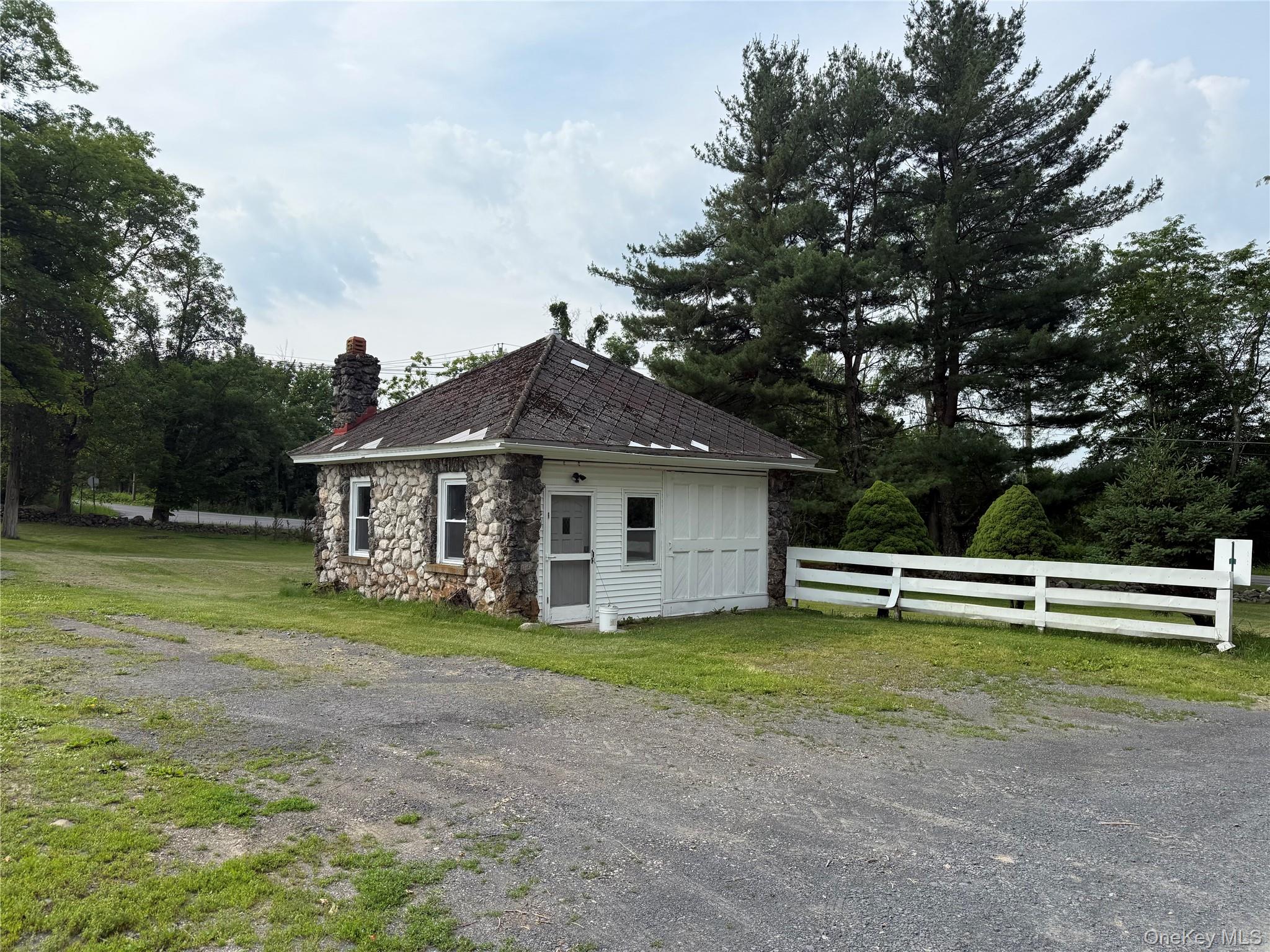 212 Cheechunk Road Goshen, NY 10924 - Photo 3 of 10 a view of a house with a yard and sitting area