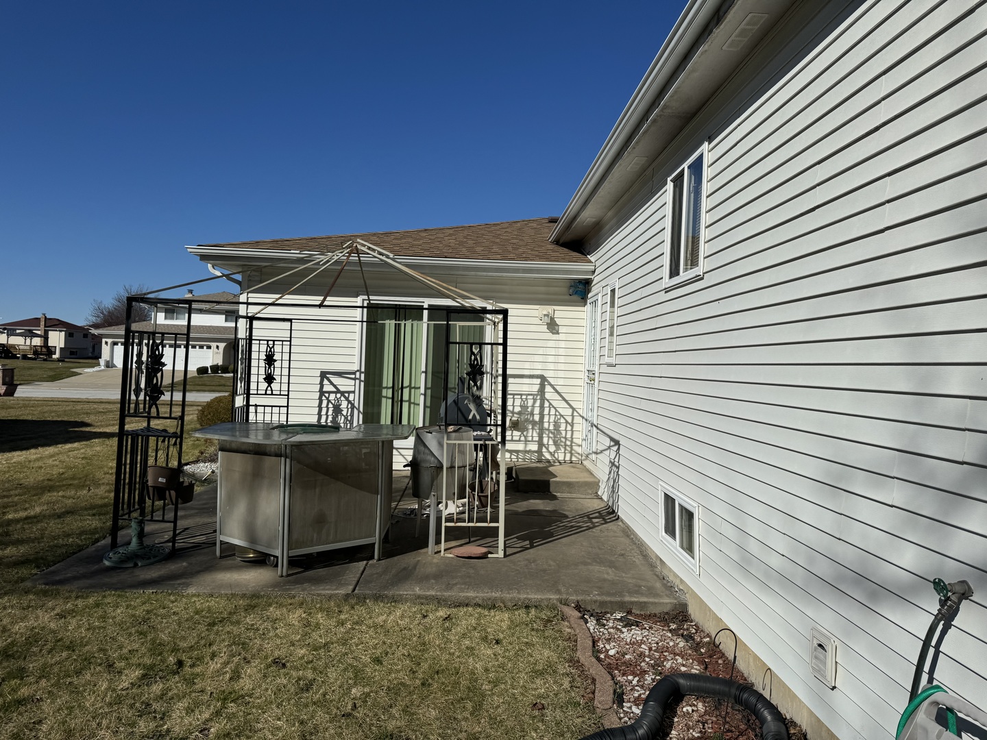 209 Churn Road Matteson, IL 60443 - Photo 13 of 26 a patio with table and chairs and potted plants
