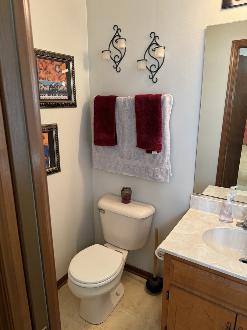209 Churn Road Matteson, IL 60443 - Photo 15 of 26 a bathroom with a toilet sink and mirror