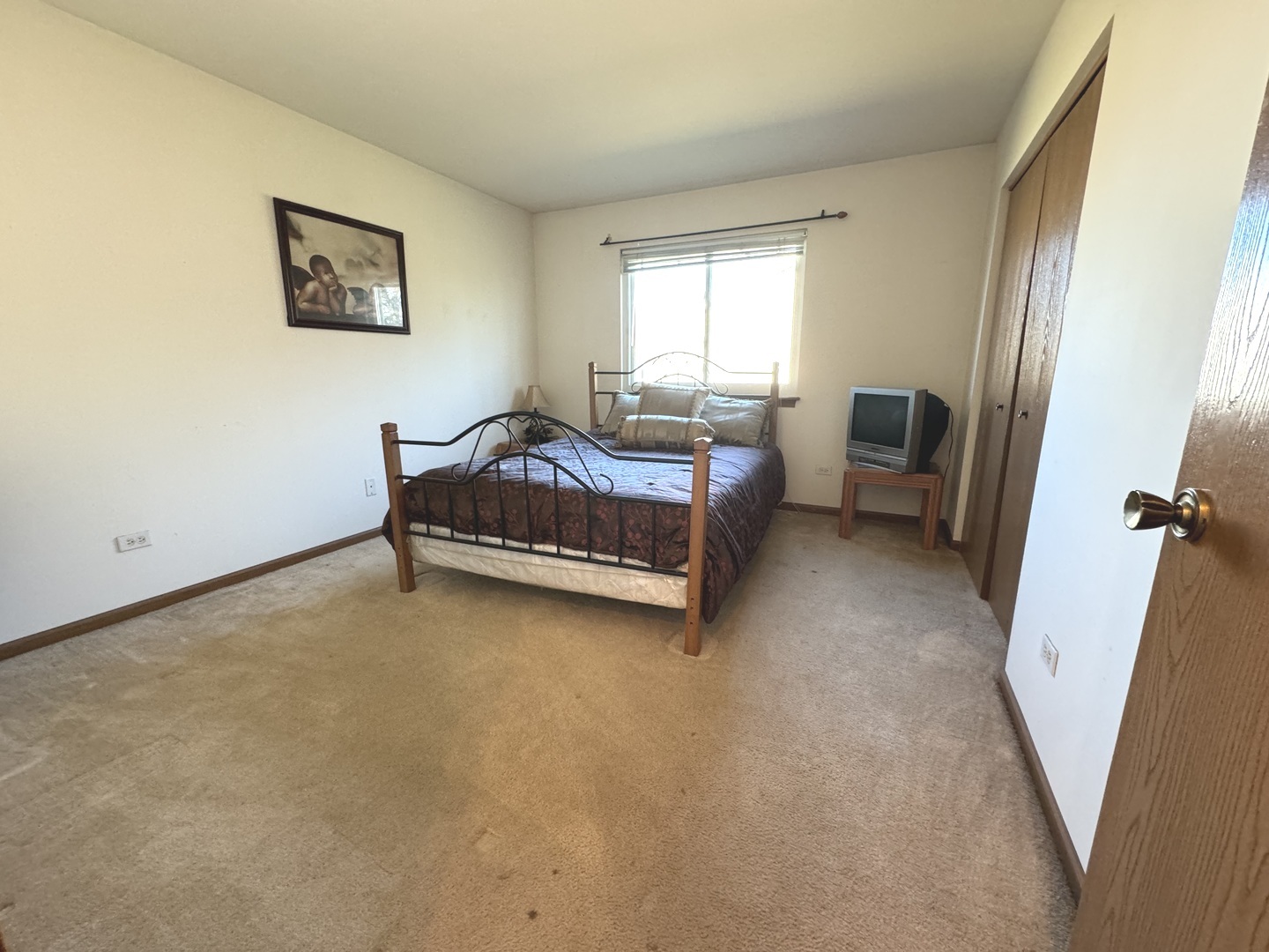 209 Churn Road Matteson, IL 60443 - Photo 18 of 26 a bedroom with a bed and a window