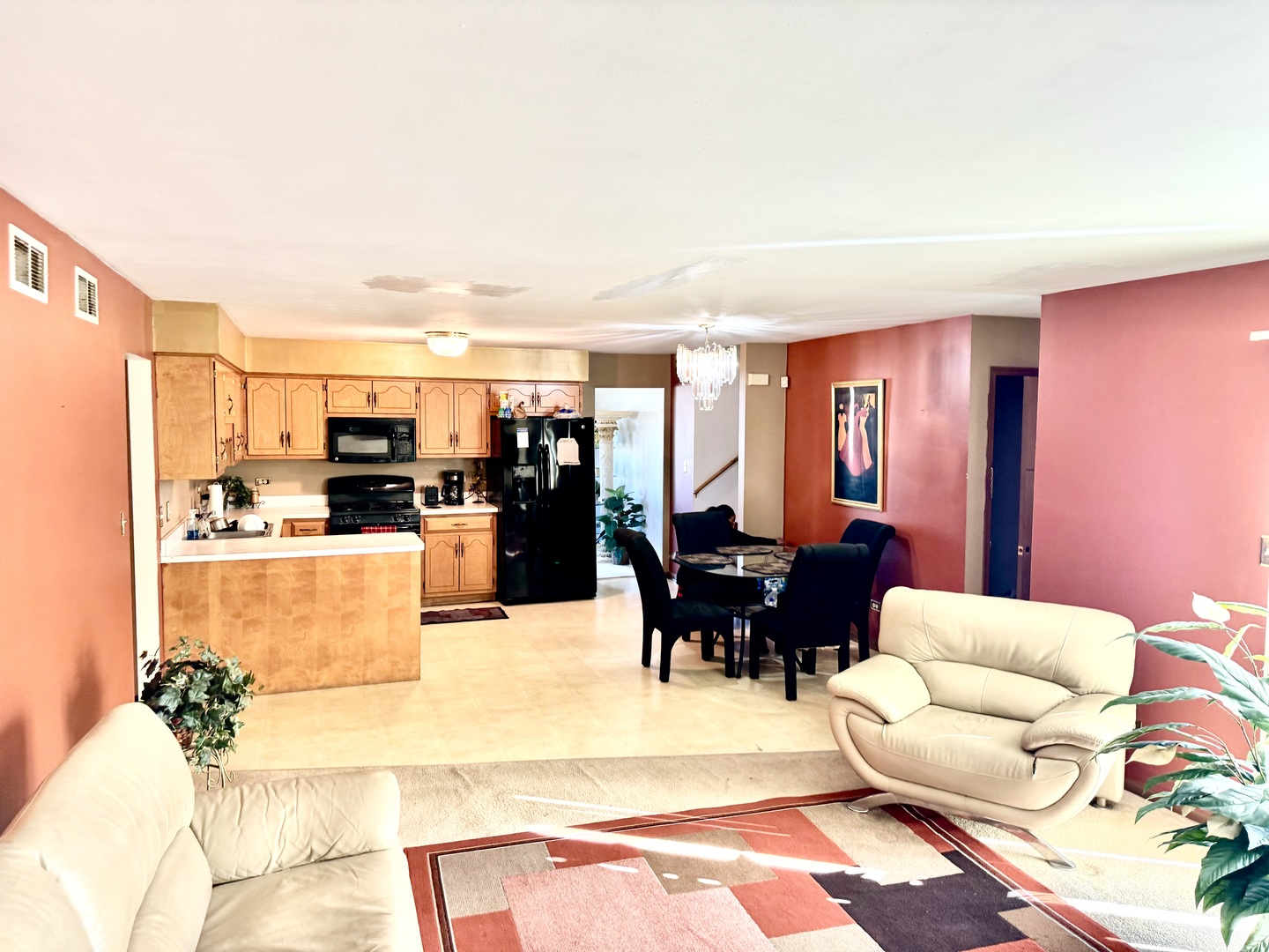 209 Churn Road Matteson, IL 60443 - Photo 23 of 26 a living room with furniture and kitchen view