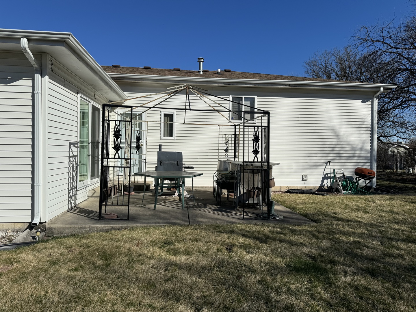 209 Churn Road Matteson, IL 60443 - Photo 7 of 26 a view of backyard with wheel chair and potted plants