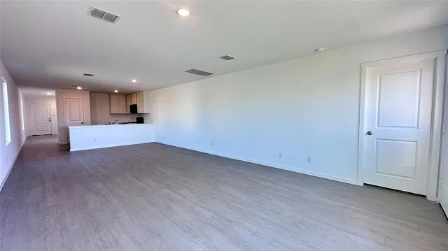 a view of a kitchen with a sink and a large window