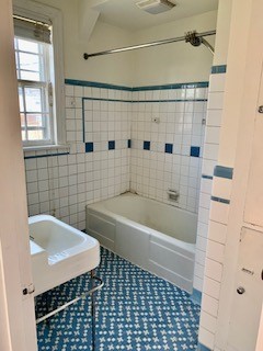 249 Lauderdale Road Nashville, TN 37205 - Photo 12 of 17 a bathroom with a bathtub a sink a window and a shower