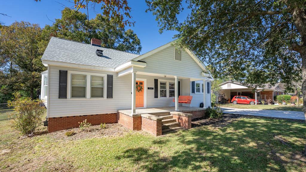 7047 Mellwood Road Columbus, GA 31904 - Photo 1 of 34 a front view of house with yard nad seating space