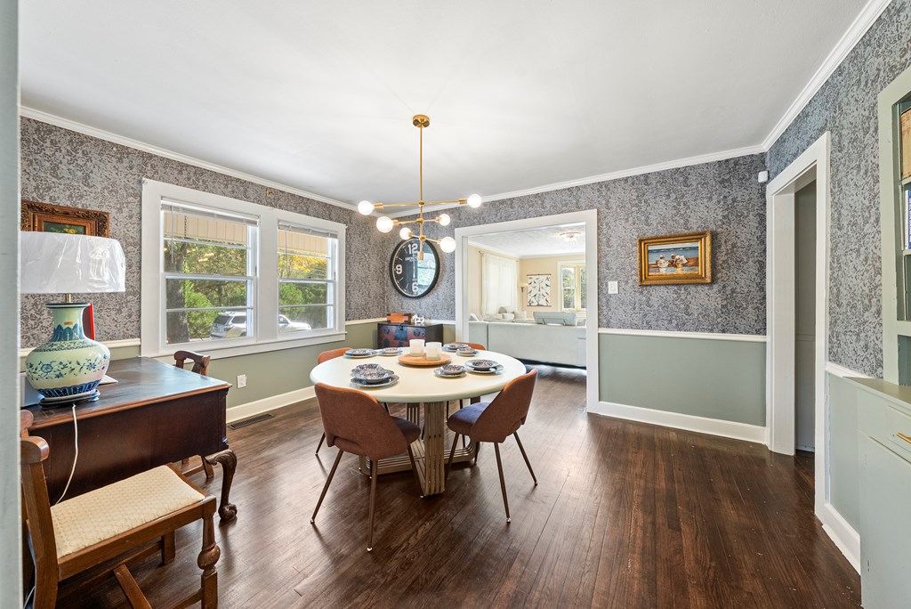 7047 Mellwood Road Columbus, GA 31904 - Photo 12 of 34 a view of a dining room with furniture window and wooden floor