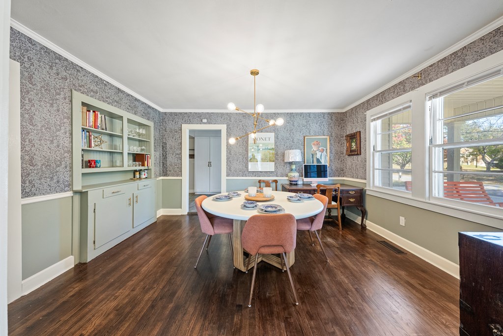 7047 Mellwood Road Columbus, GA 31904 - Photo 13 of 34 a view of a dining room with furniture window and wooden floor