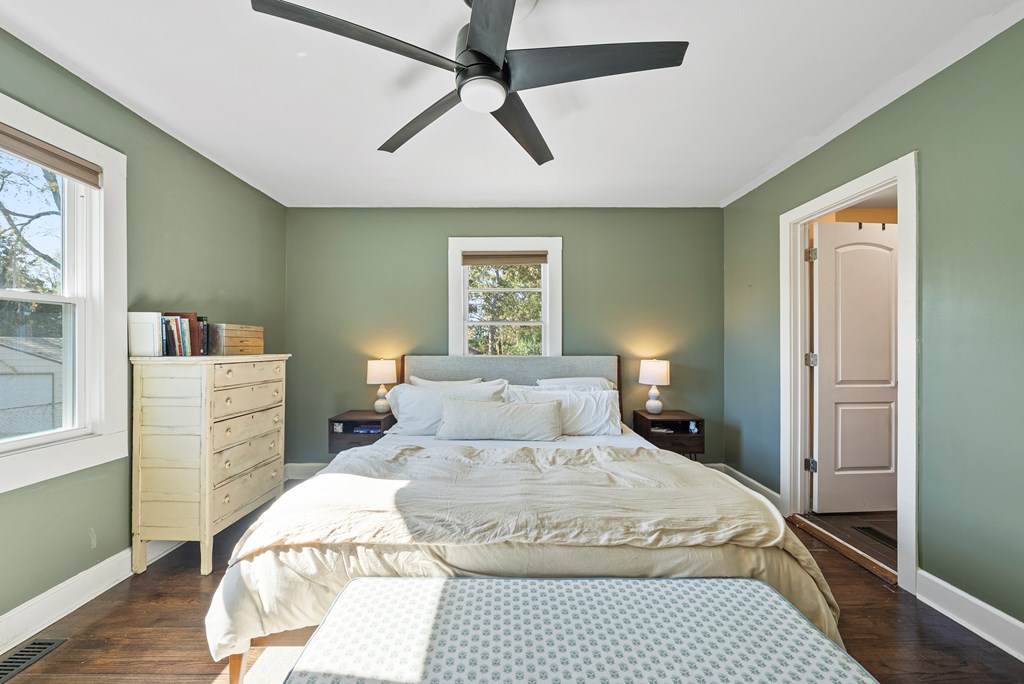 7047 Mellwood Road Columbus, GA 31904 - Photo 18 of 34 a bedroom with a bed and wooden floor