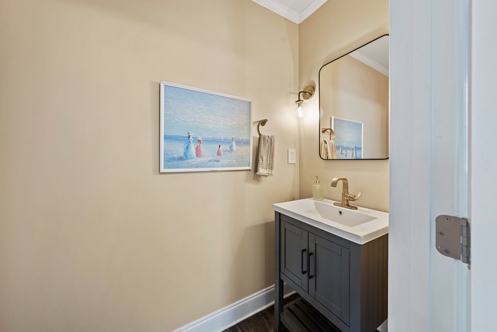 7047 Mellwood Road Columbus, GA 31904 - Photo 22 of 34 a bathroom with a sink and mirror