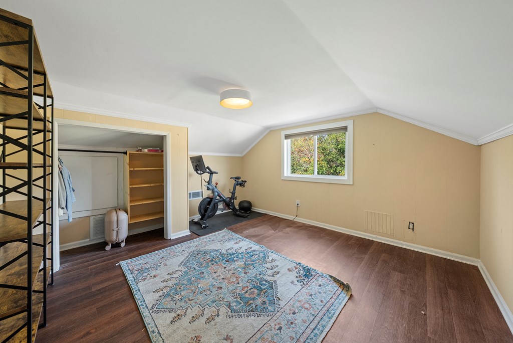 7047 Mellwood Road Columbus, GA 31904 - Photo 28 of 34 an empty room with furniture and wooden floor