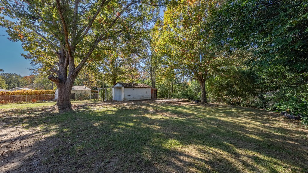 7047 Mellwood Road Columbus, GA 31904 - Photo 31 of 34 a big yard with lots of green space and trees
