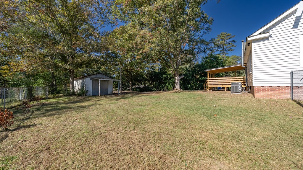 7047 Mellwood Road Columbus, GA 31904 - Photo 33 of 34 a front view of a house with a yard and garage