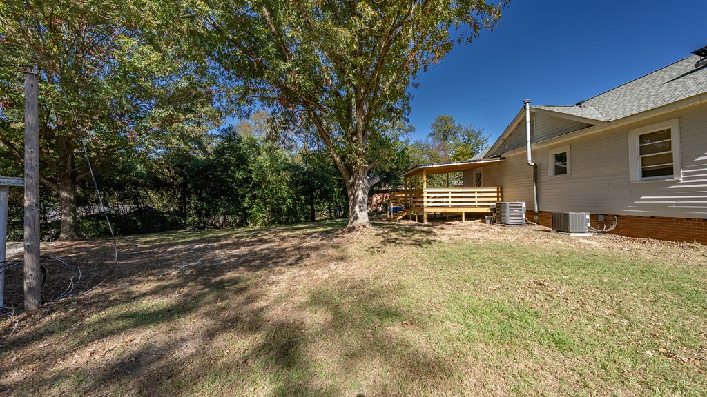 7047 Mellwood Road Columbus, GA 31904 - Photo 34 of 34 a view of house with backyard and trees