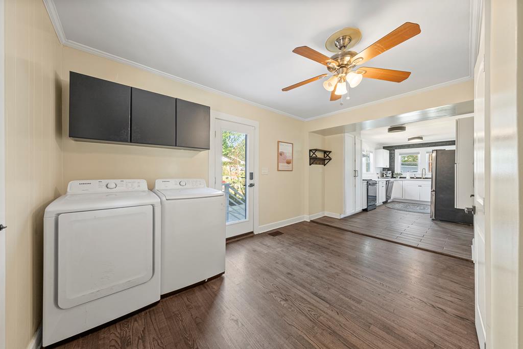 7047 Mellwood Road Columbus, GA 31904 - Photo 6 of 34 a view of a livingroom with furniture wooden floor and a ceiling fan