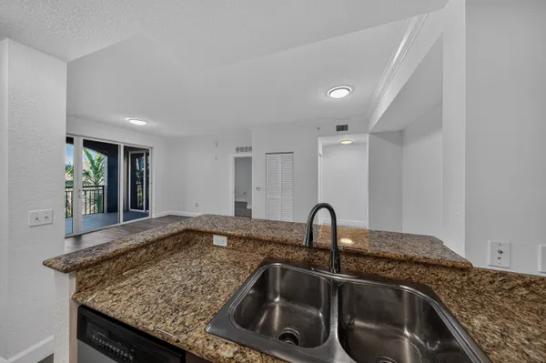 a kitchen with a sink and a window