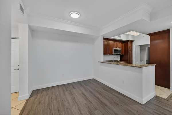 wooden floor in an empty room with a mirror