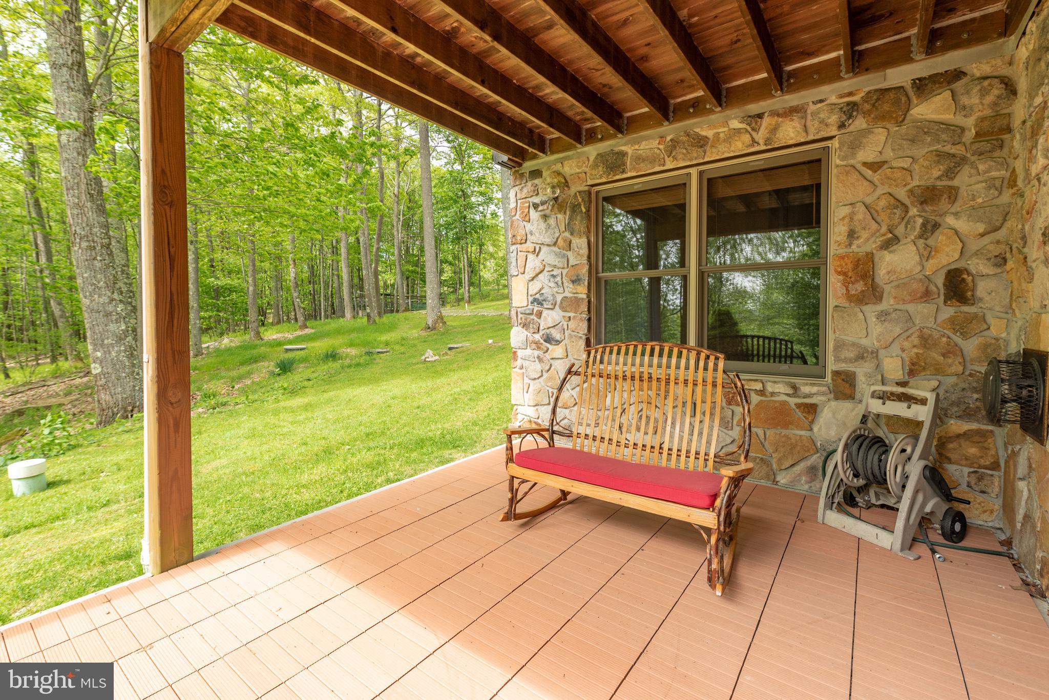 615 Sandy Shores Road Oakland, MD 21550 - Photo 90 of 103 Serene porch with natural stone accents.