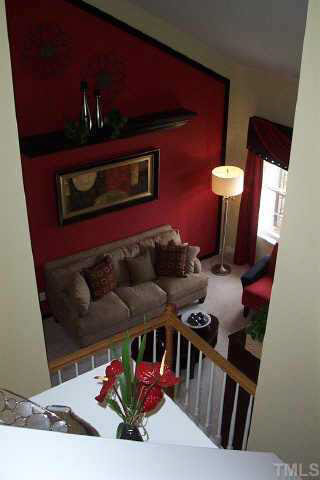 7831 Averette Hill Drive Raleigh, NC 27616 - Photo 4 of 10 a living room with furniture and stairs