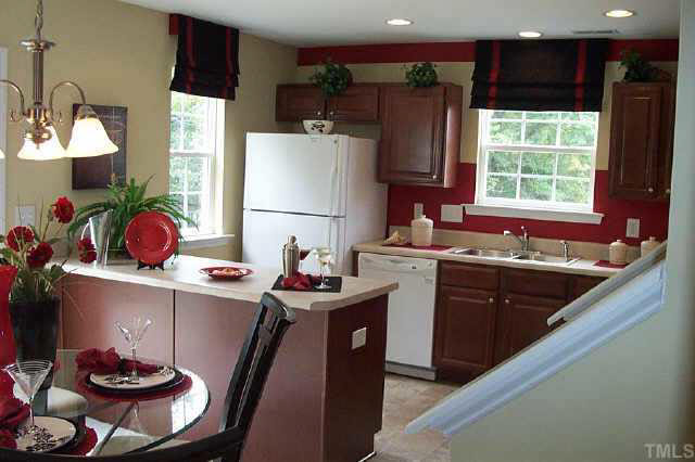 7831 Averette Hill Drive Raleigh, NC 27616 - Photo 7 of 10 a kitchen with a sink stove and refrigerator