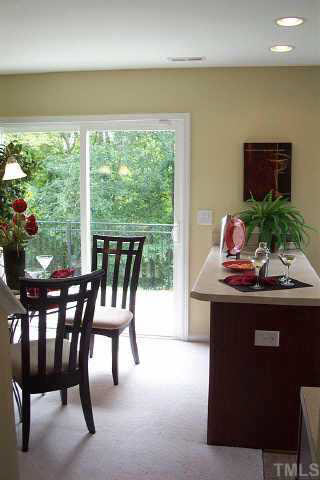 7831 Averette Hill Drive Raleigh, NC 27616 - Photo 10 of 10 a view of a dining room with furniture window and outside view