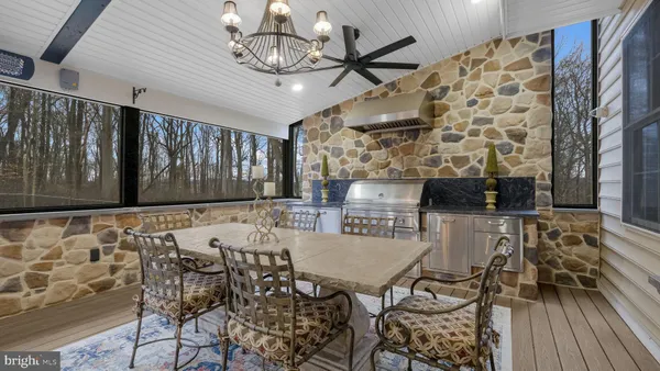 a view of a playground with a patio and fire pit
