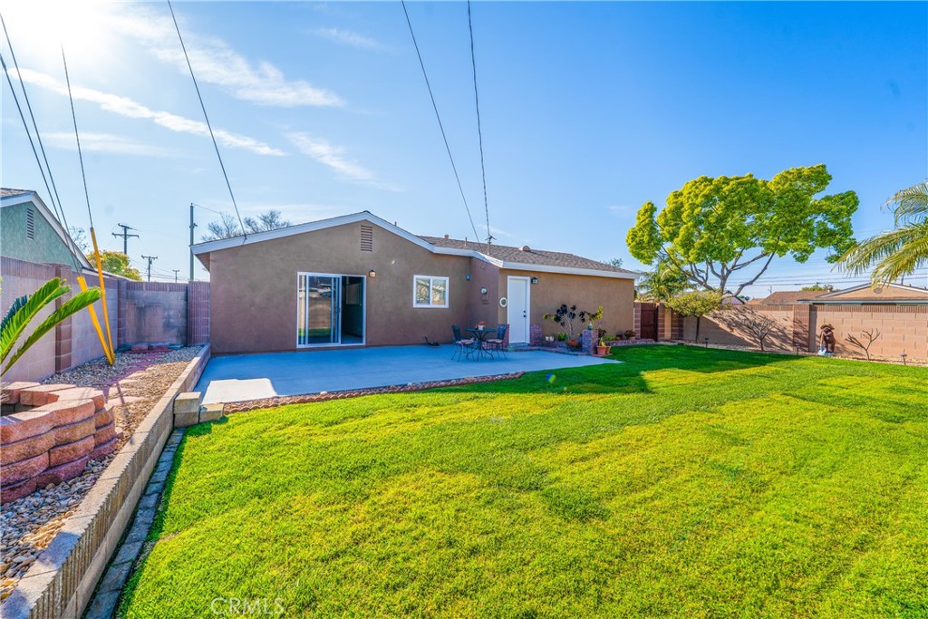 10282 Longden Street Cypress, CA 90630 - Photo 16 of 43 a front view of house with yard and outdoor seating