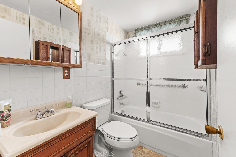 10282 Longden Street Cypress, CA 90630 - Photo 28 of 43 a bathroom with a sink toilet and shower