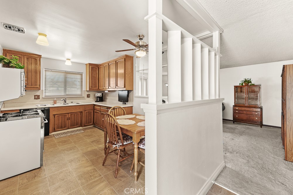 10282 Longden Street Cypress, CA 90630 - Photo 29 of 43 a kitchen with a refrigerator and cabinets