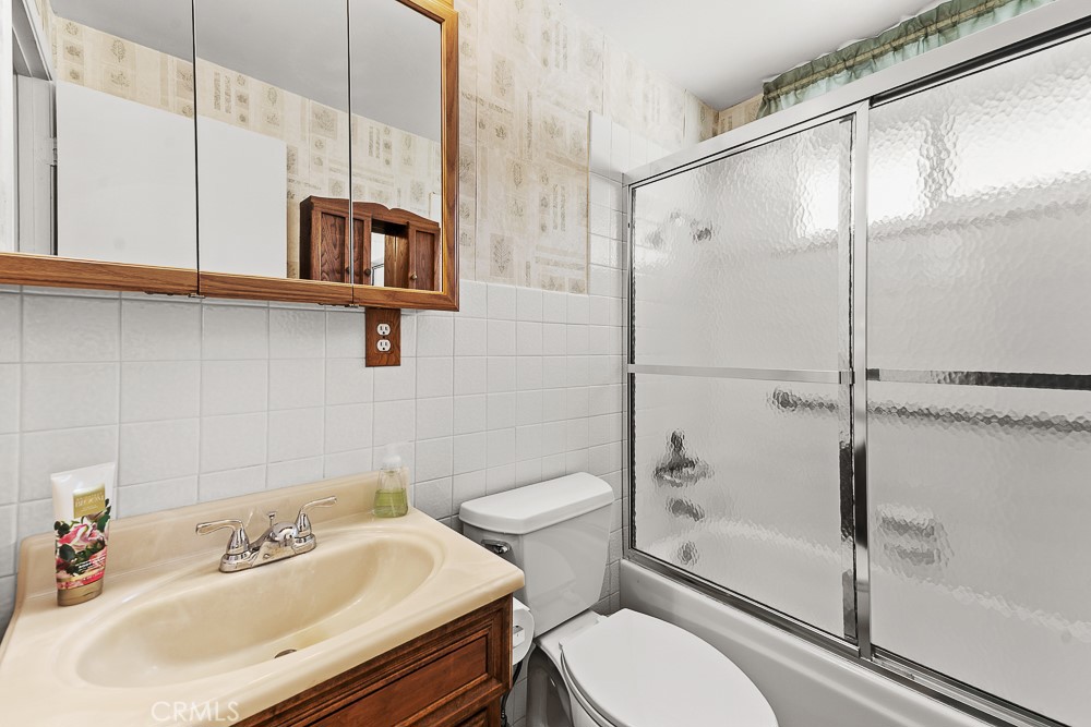 10282 Longden Street Cypress, CA 90630 - Photo 33 of 43 a bathroom with a sink toilet and shower