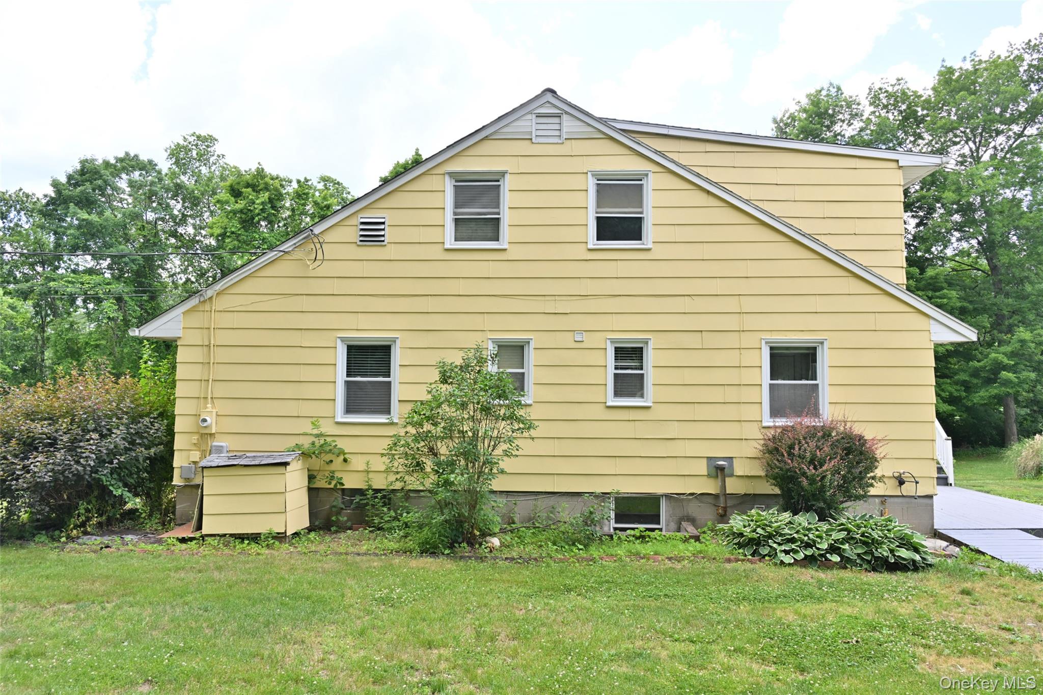 136 Foggintown Road Brewster, NY 10509 - Photo 43 of 50 a front view of a house with a yard
