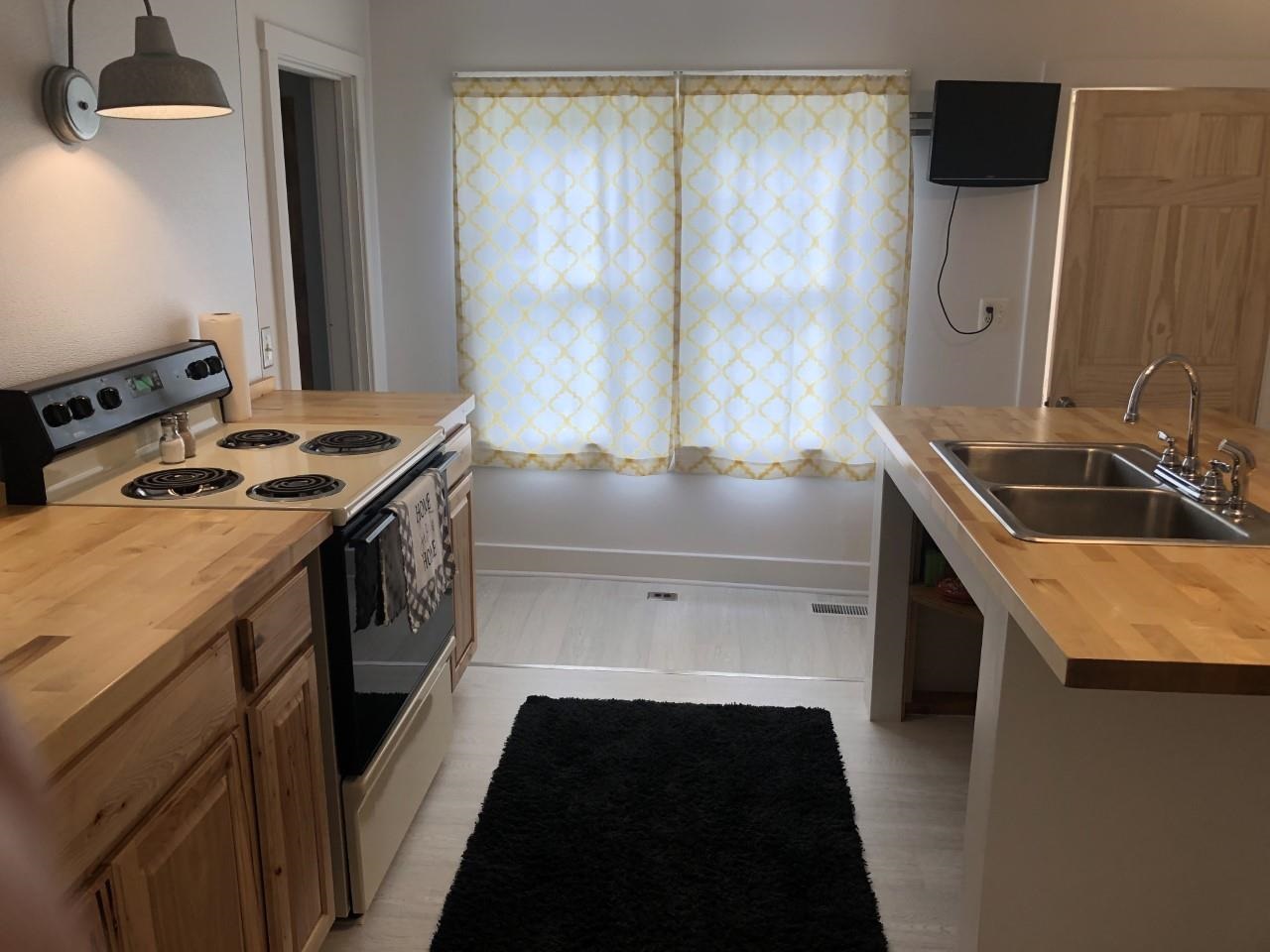 55 Dorcas Road Mount Solon, VA 22843 - Photo 14 of 29 a kitchen with a sink stove and cabinets