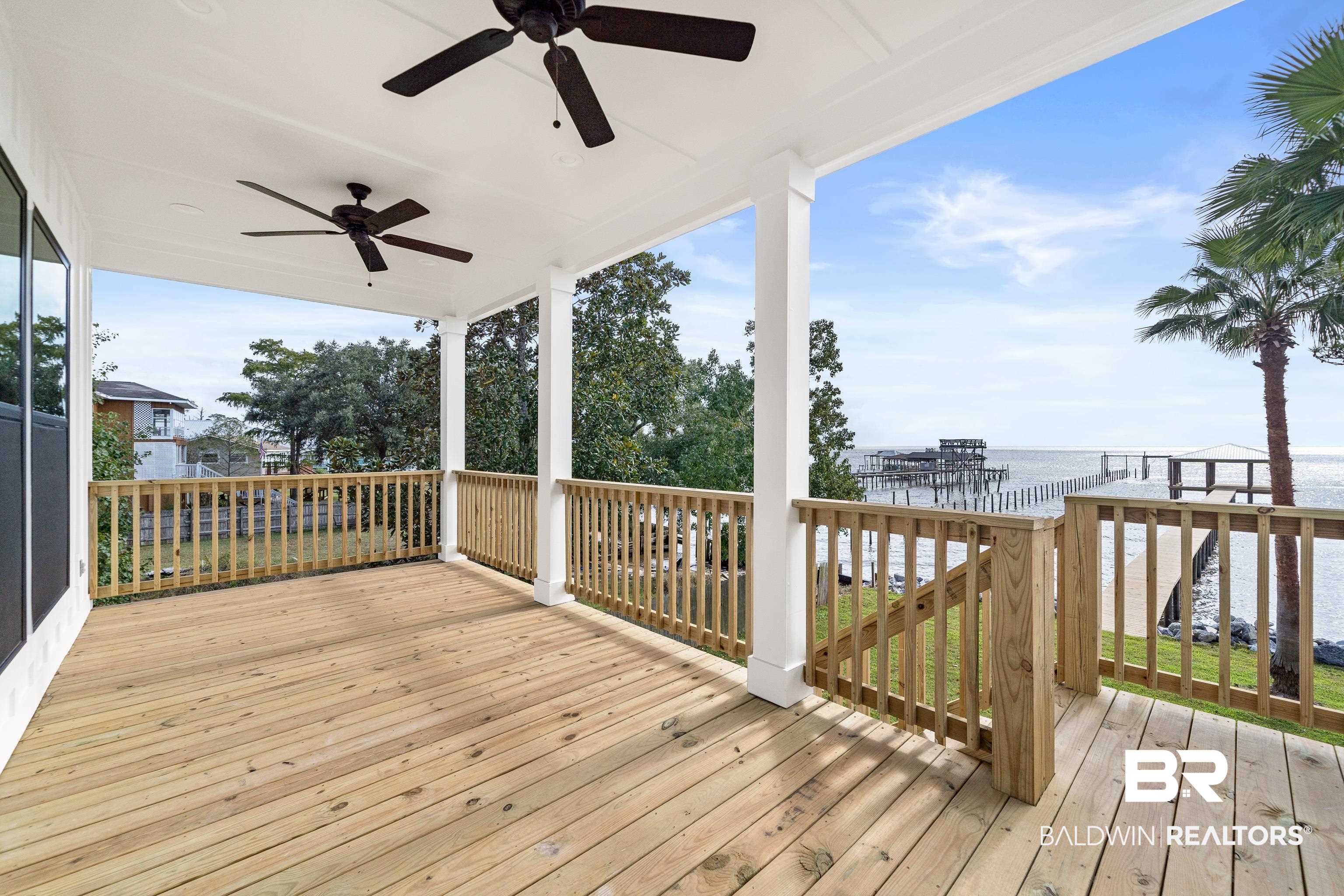 12453 County Road 1 Fairhope, AL 36532 - Photo 26 of 33 Wooden deck featuring a water view and ceiling fan