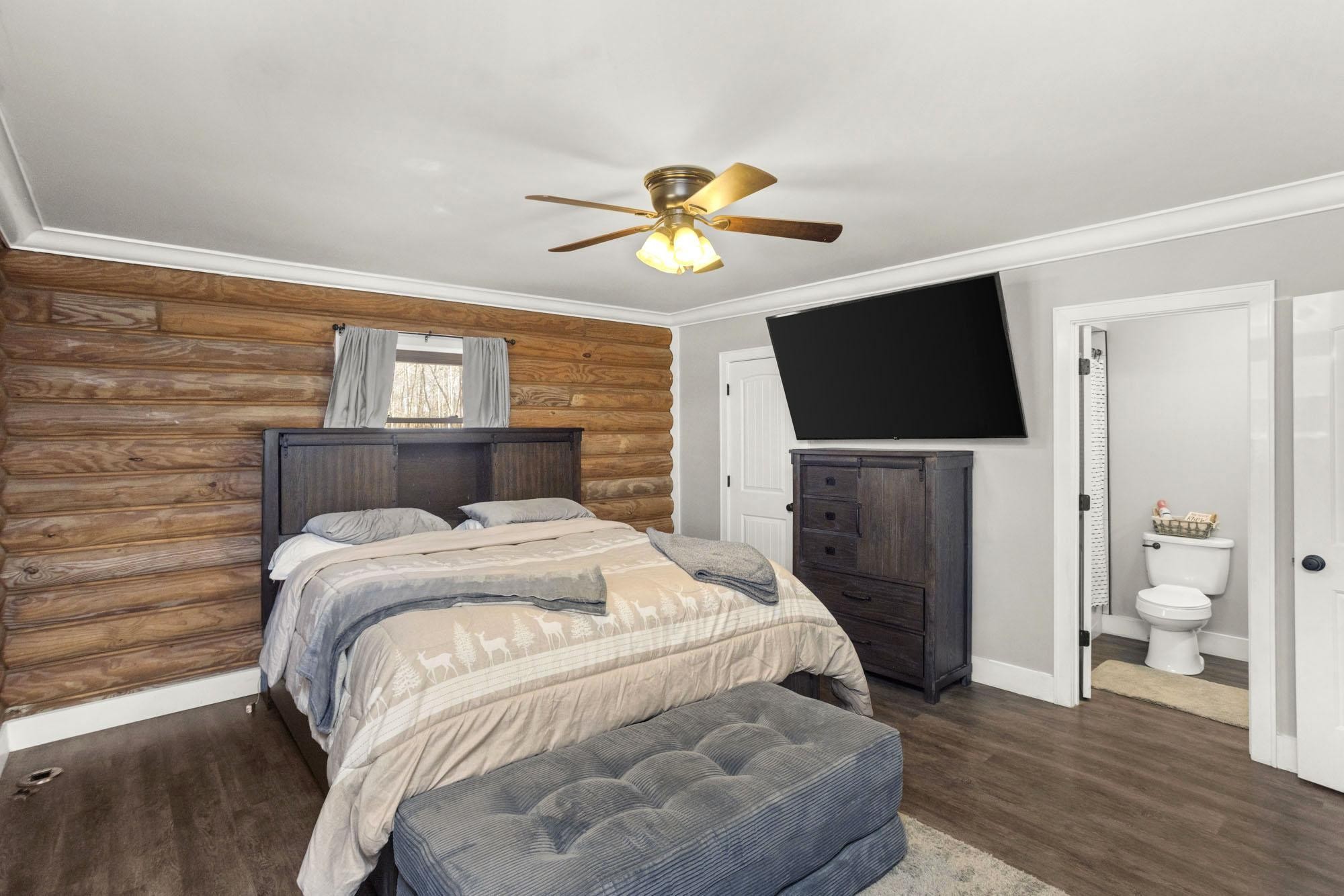 1300 Ridge Road Dickson, TN 37055 - Photo 11 of 60 a bedroom with a bed and a flat screen tv