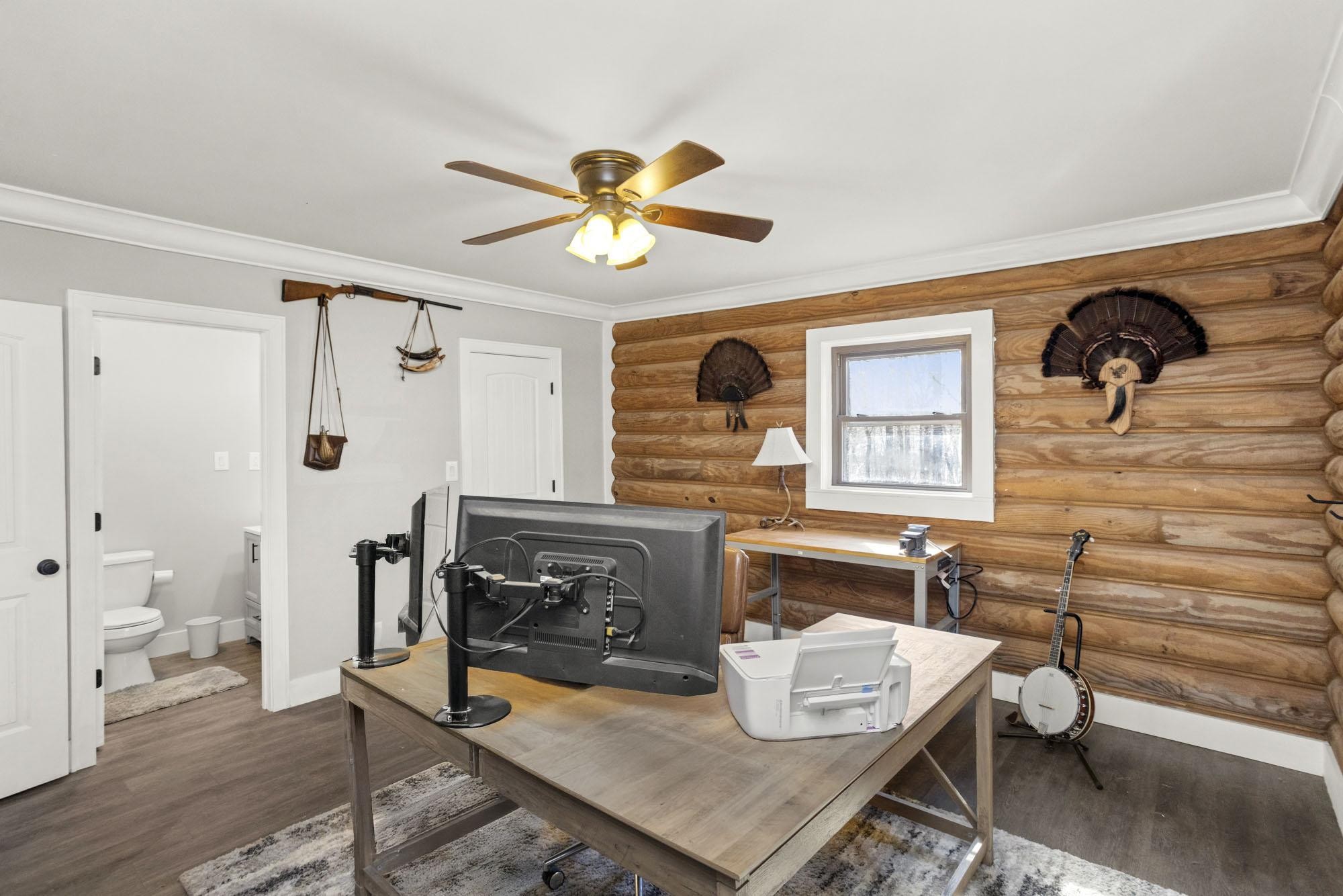 1300 Ridge Road Dickson, TN 37055 - Photo 17 of 60 a view of a workspace with furniture and a window
