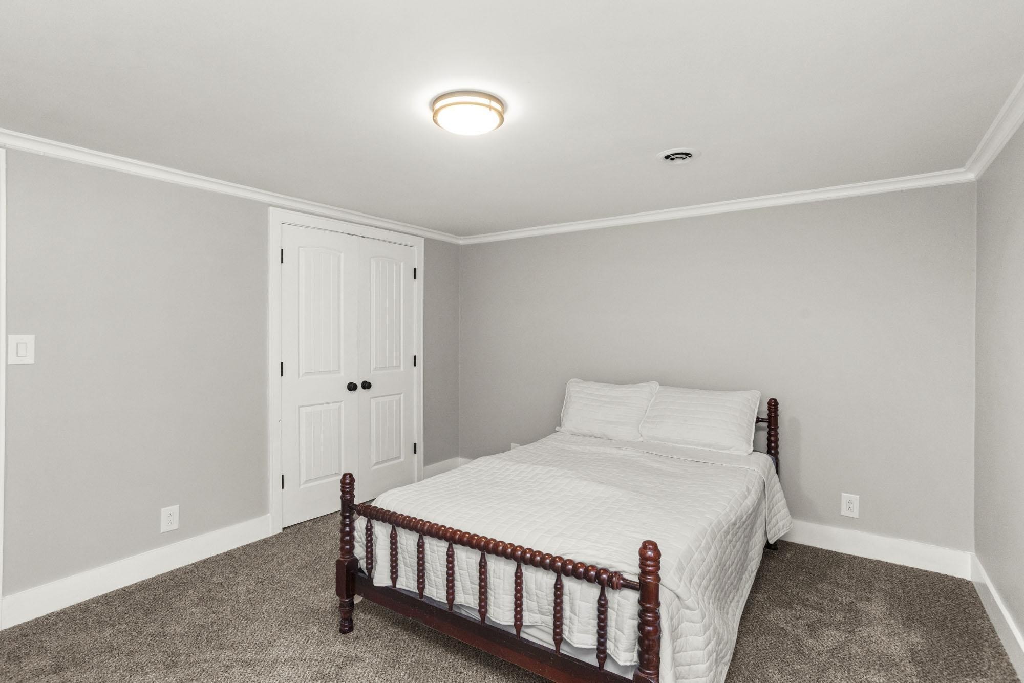 1300 Ridge Road Dickson, TN 37055 - Photo 35 of 60 a bedroom with a bed and a window