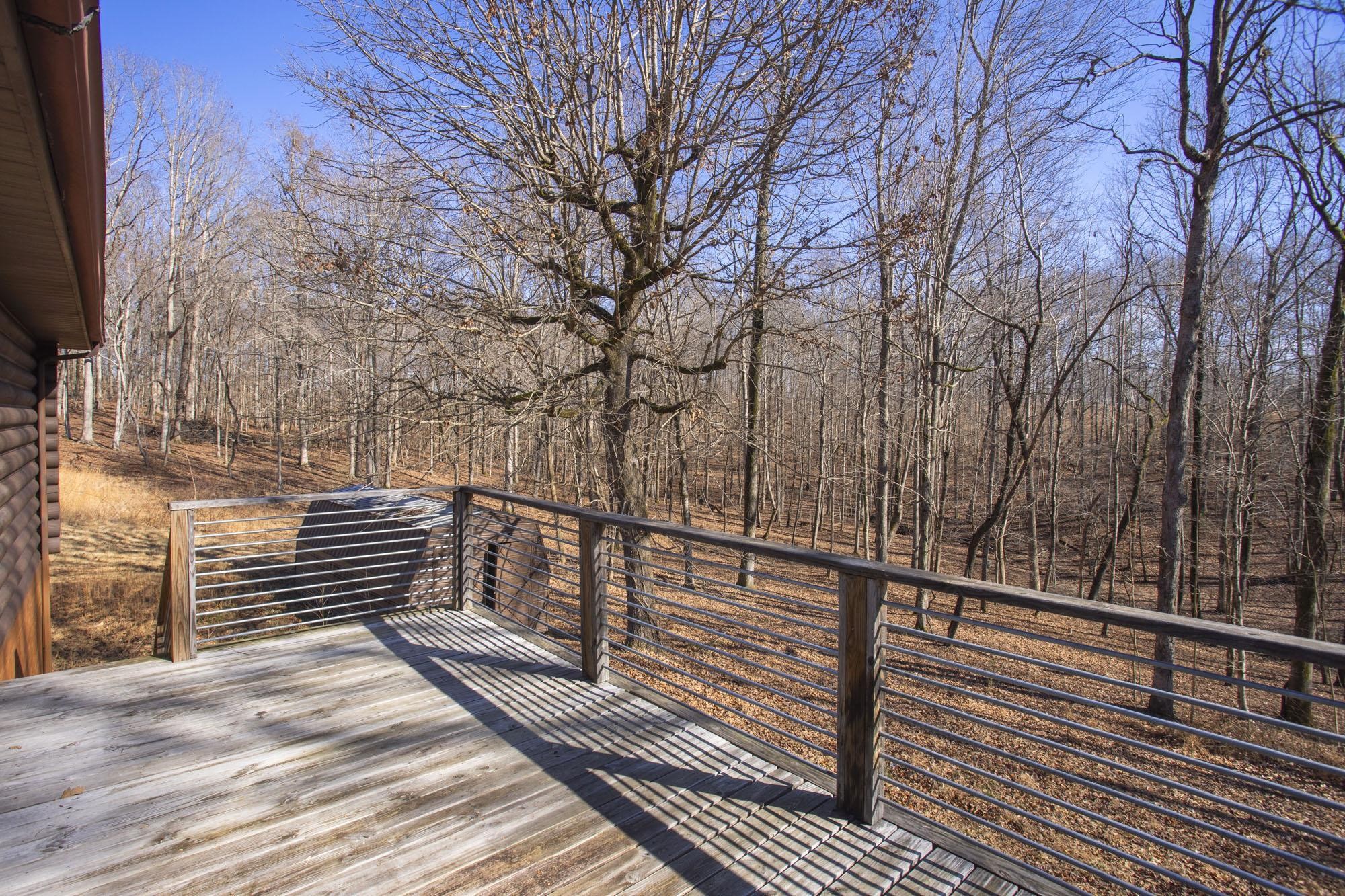 1300 Ridge Road Dickson, TN 37055 - Photo 40 of 60 a view of a balcony with wooden floor and fence