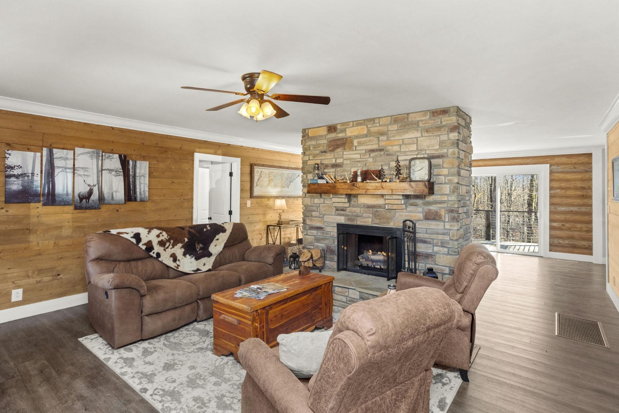 1300 Ridge Road Dickson, TN 37055 - Photo 7 of 60 a living room with furniture a fireplace and a floor to ceiling window
