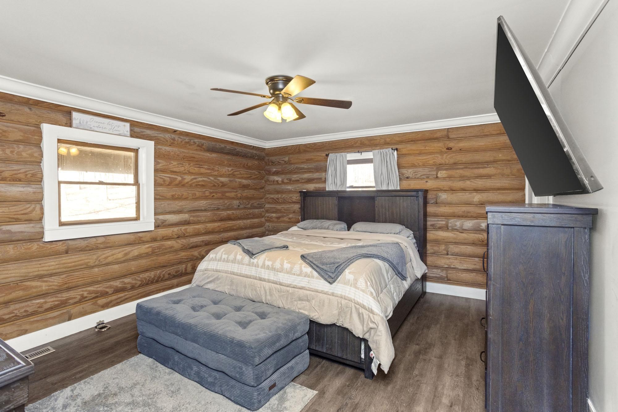 1300 Ridge Road Dickson, TN 37055 - Photo 10 of 60 a bedroom with a bed and a couch