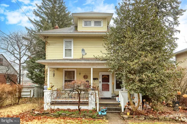 a front view of a house with a porch