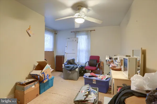 a living room with furniture a rug and a chandelier