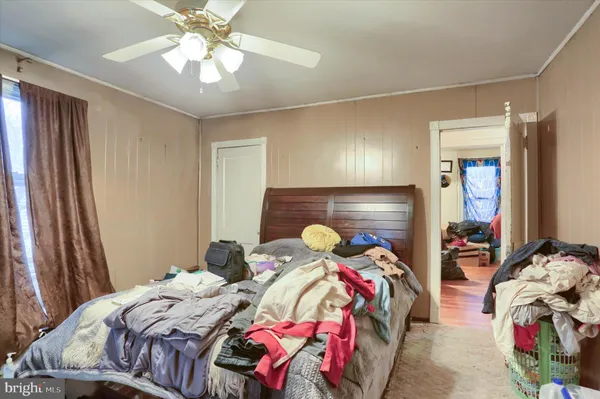 a bedroom with two beds and a chandelier
