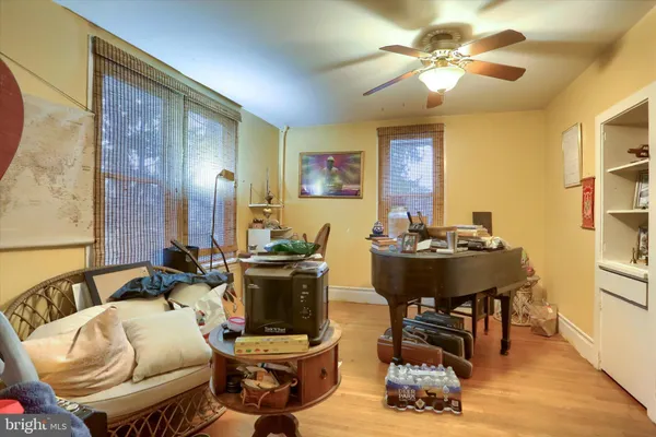 a living room with furniture a chandelier and a window
