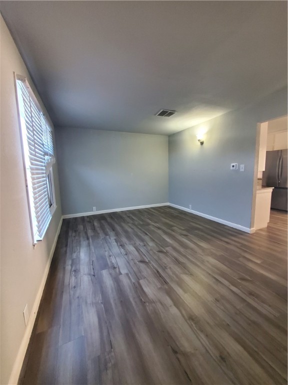 3605 Poplar Street Corpus Christi, TX 78411 - Photo 5 of 11 wooden floor in an empty room with a window