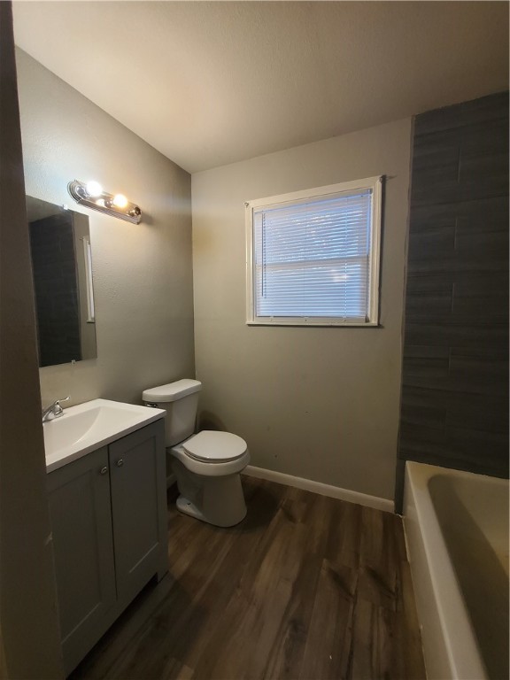 3605 Poplar Street Corpus Christi, TX 78411 - Photo 7 of 11 a bathroom with a toilet sink and mirror
