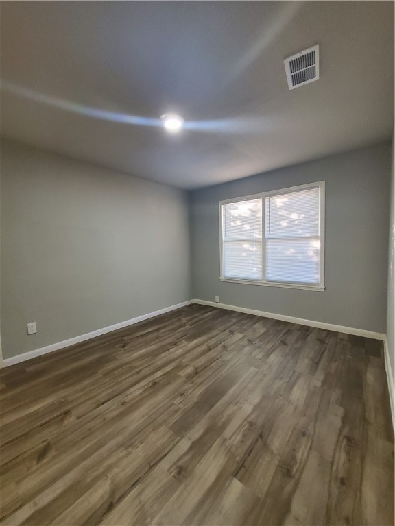 3605 Poplar Street Corpus Christi, TX 78411 - Photo 8 of 11 an empty room with wooden floor and windows